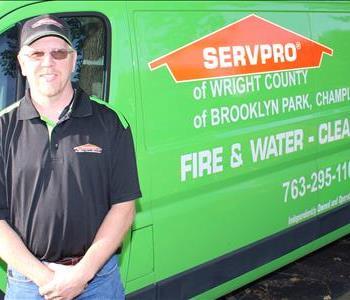 Man standing by SERVPRO Vehicle