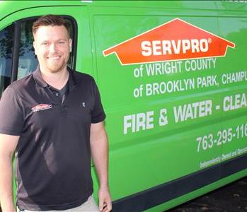 Man standing by SERVPRO Vehicle